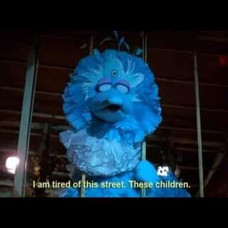 Big Bird, looking like Dr. Manhattan. Caption: I am tired of this street. These Children.