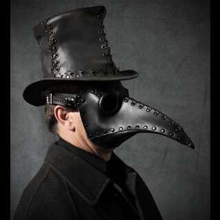 A gentleman wearing a fashionable leather tophat and medieval beak-like plague mask.