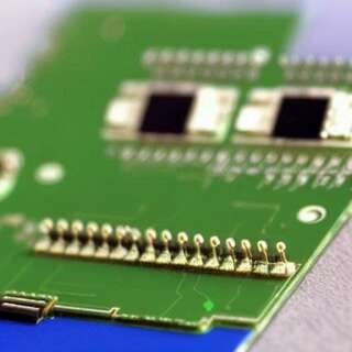 AI Art, a circuit board with a familiar looking face.